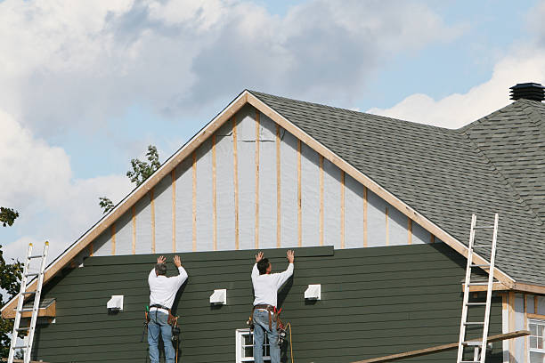 Professional Siding Installation technician working in Kenly, NC